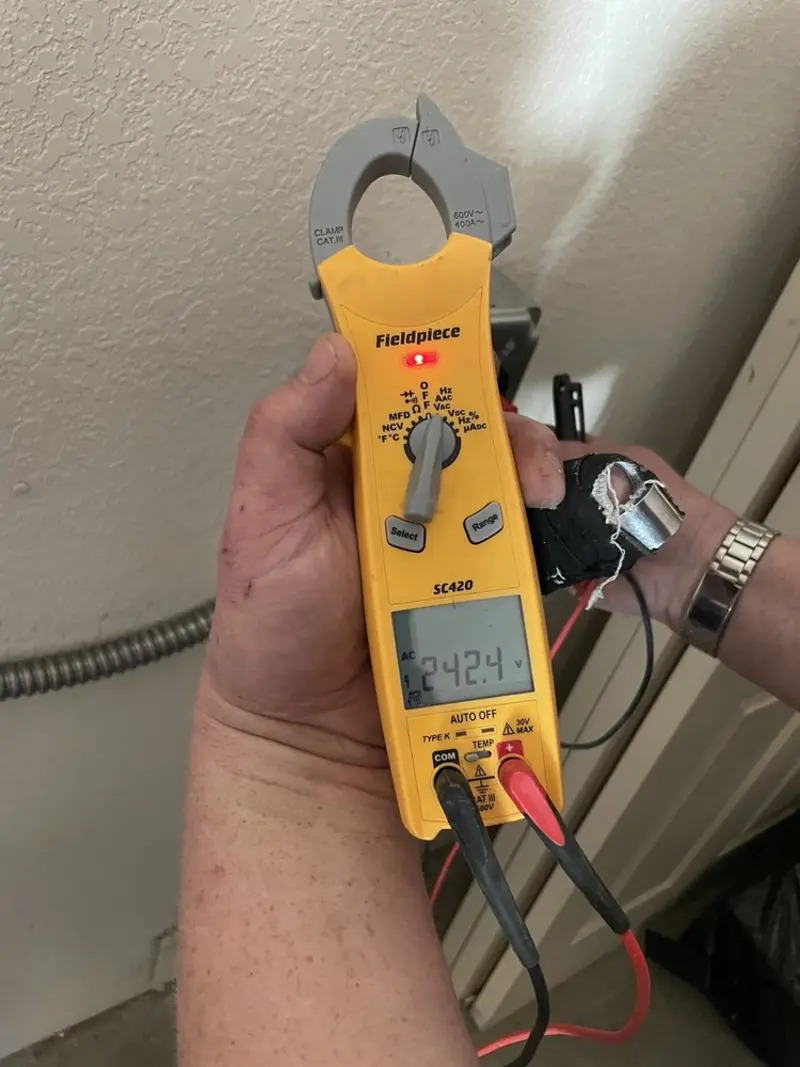 Voltage testing with clamp meter during Ceiling Fan Installation in Harwinton